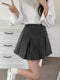 Nina | Mooie geplooide minirok met hoge taille in effen kleur