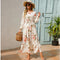 Petra - Fashionable floral dress with a round neckline