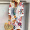 Renesme - Watercolor dress with small floral print in the middle of the sleeves
