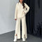 Comfortable two-piece women's set in ribbed knit with trousers with slit legs
