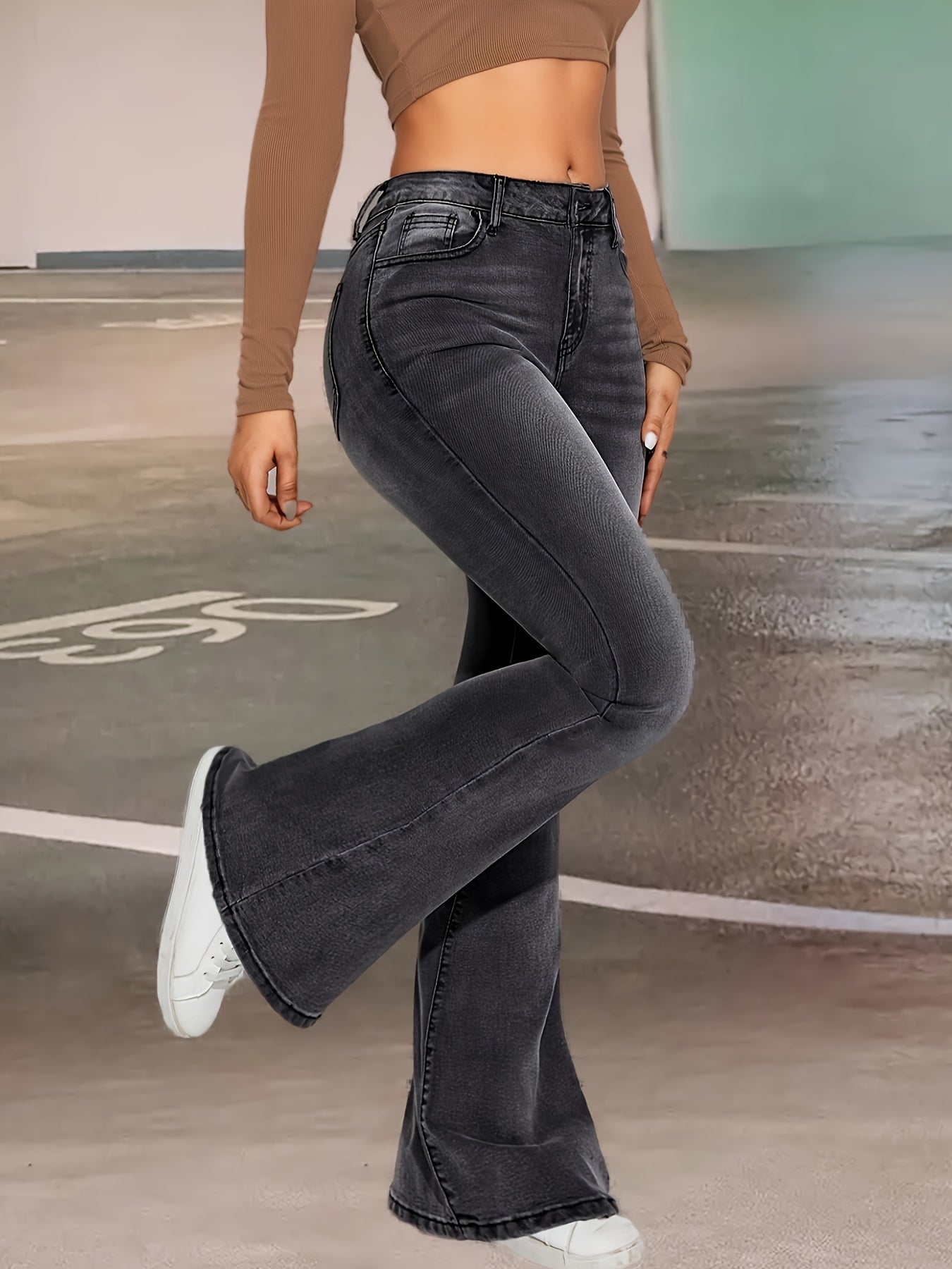 Elise | Stylish black and gray stretch flared jeans with a button detail
