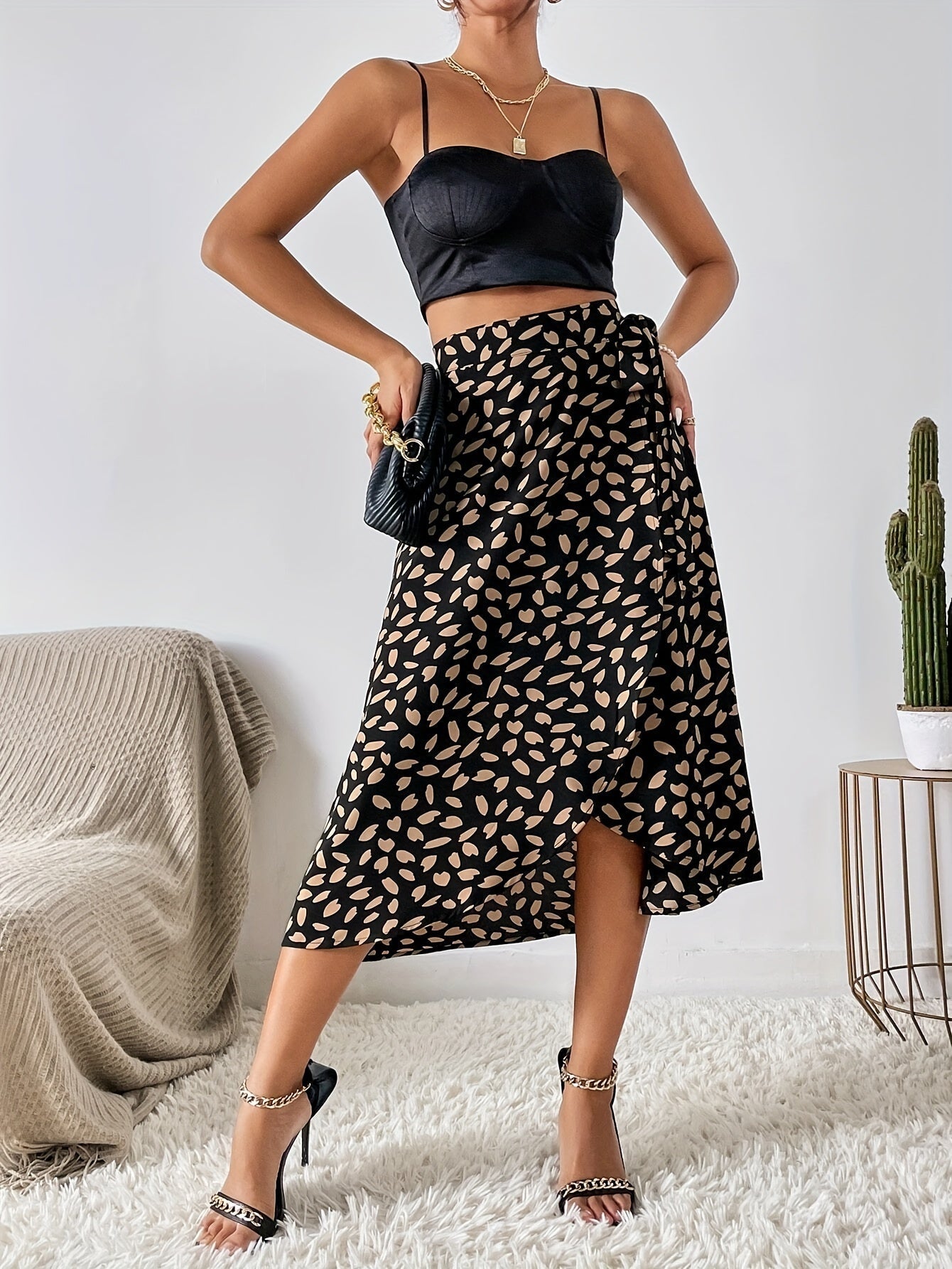 Lotte | Elegant A-line wrap skirt with a tie belt and allover print