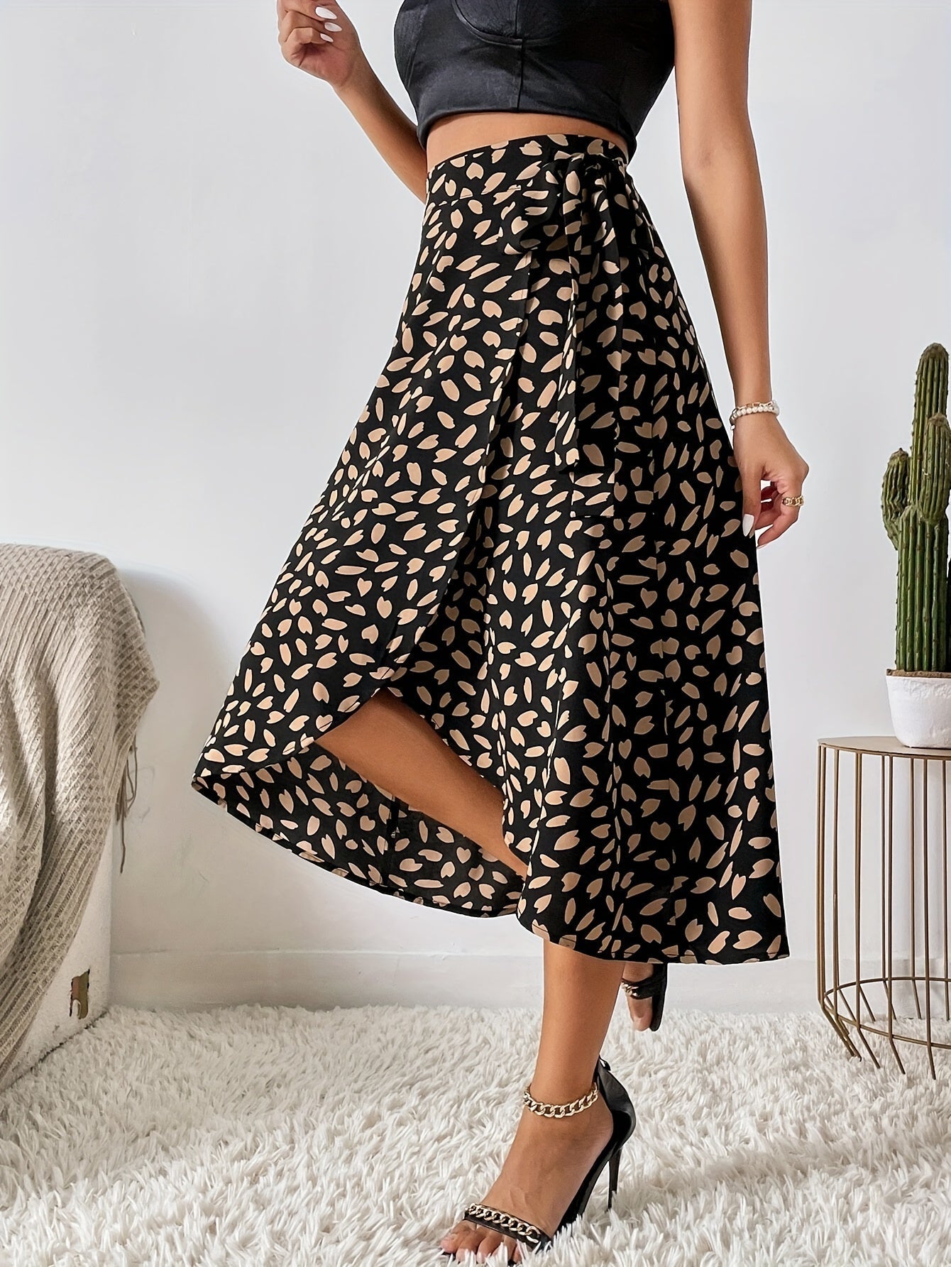 Lotte | Elegant A-line wrap skirt with a tie belt and allover print