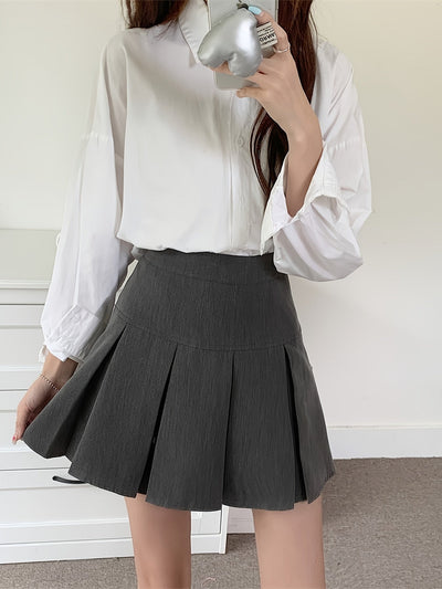 Nina | Mooie geplooide minirok met hoge taille in effen kleur