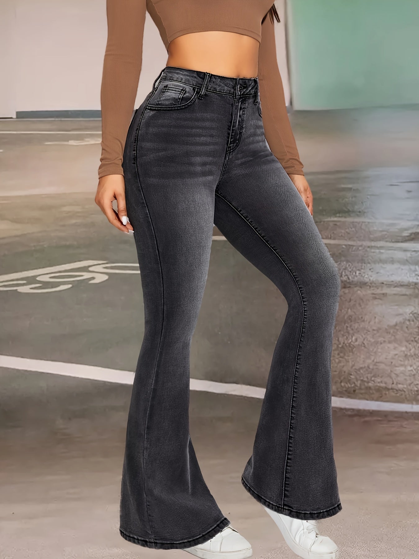 Elise | Stylish black and gray stretch flared jeans with a button detail