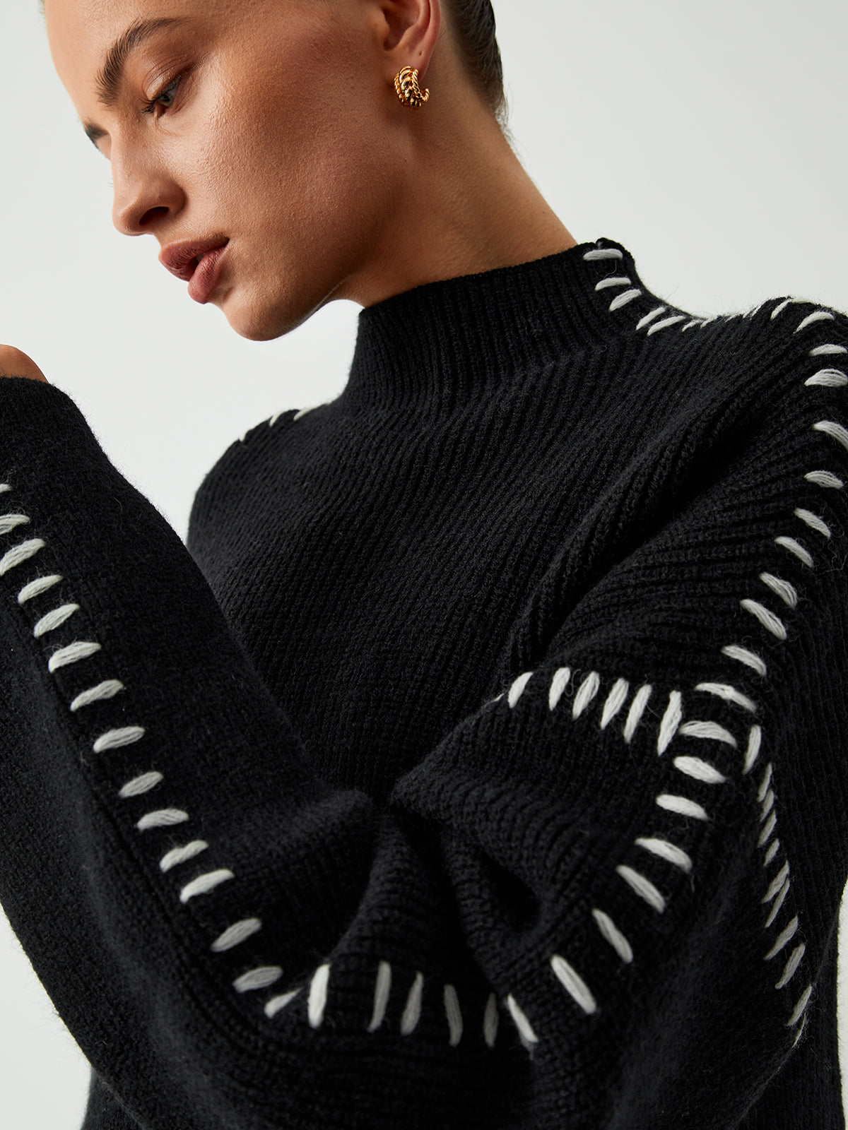 Alma coltrui met gestikte details