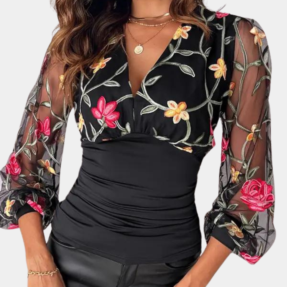 Elegant ladies' top with floral embroidery