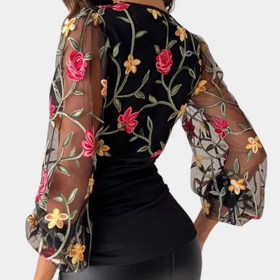 Elegant ladies' top with floral embroidery