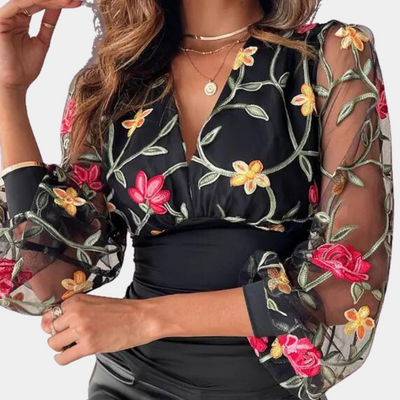 Elegant ladies' top with floral embroidery