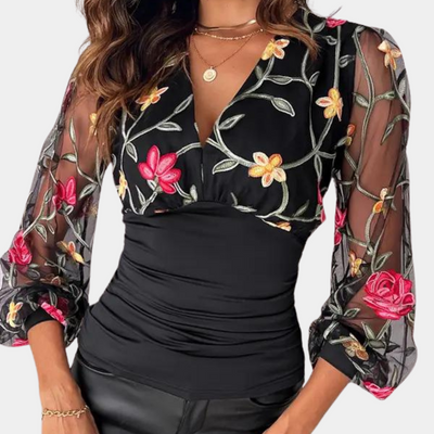 Elegant ladies' top with floral embroidery