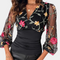 Elegant ladies' top with floral embroidery