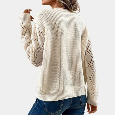 Knitted women's top with long sleeves