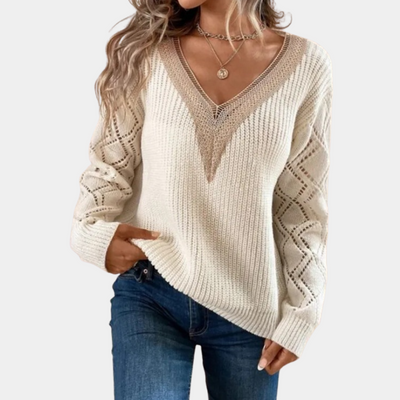 Knitted women's top with long sleeves