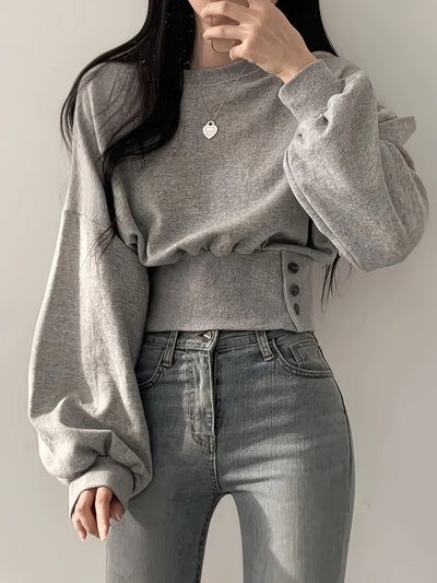 Selena | Trendy Sweater met Knoopdetails en Ballonmouwen