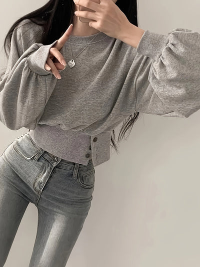 Selena | Trendy Sweater met Knoopdetails en Ballonmouwen