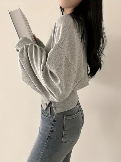 Selena | Trendy Sweater met Knoopdetails en Ballonmouwen
