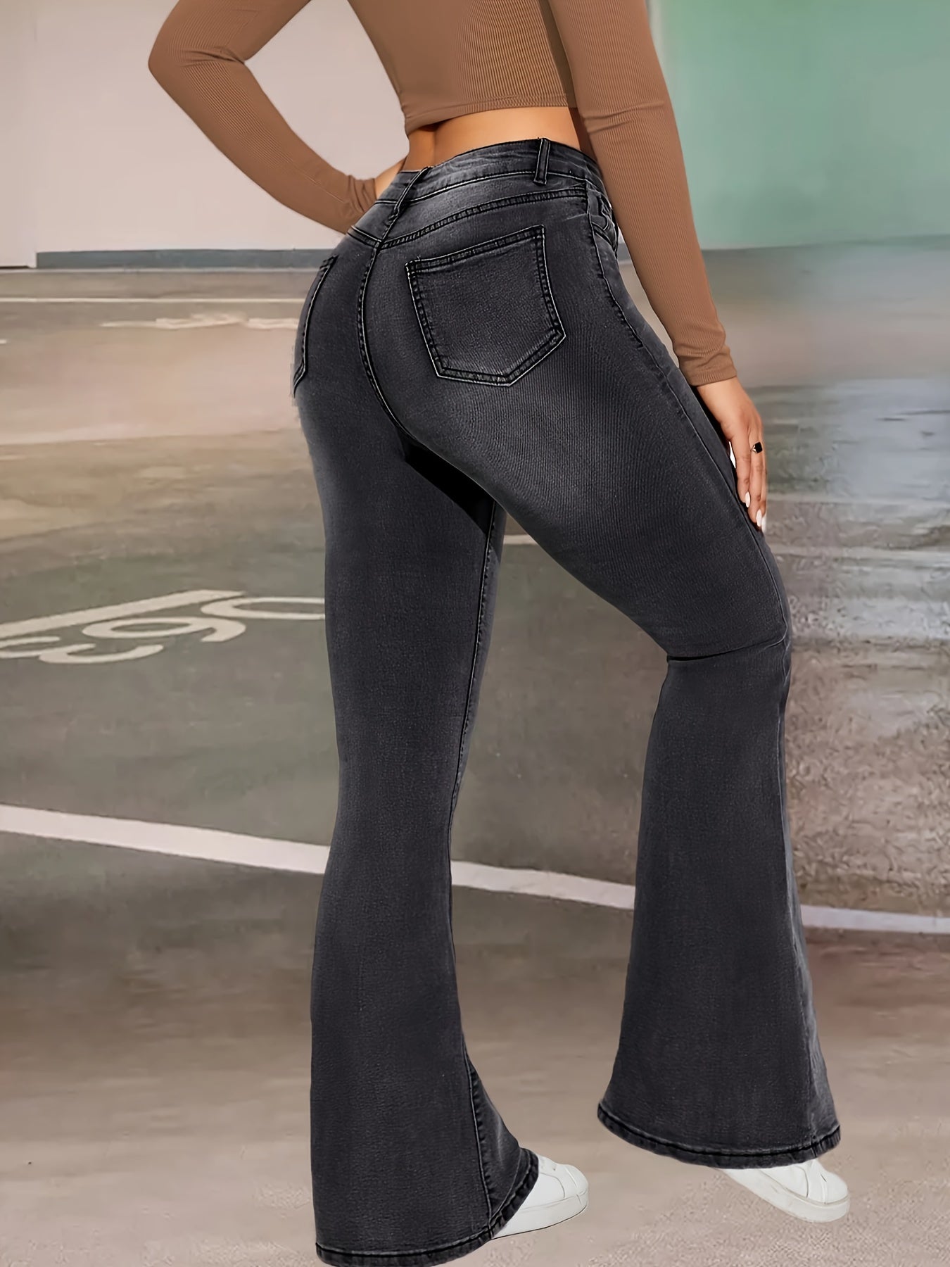 Elise | Stylish black and gray stretch flared jeans with a button detail