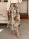 Lotte | Elegant allover print pleated A-line skirt