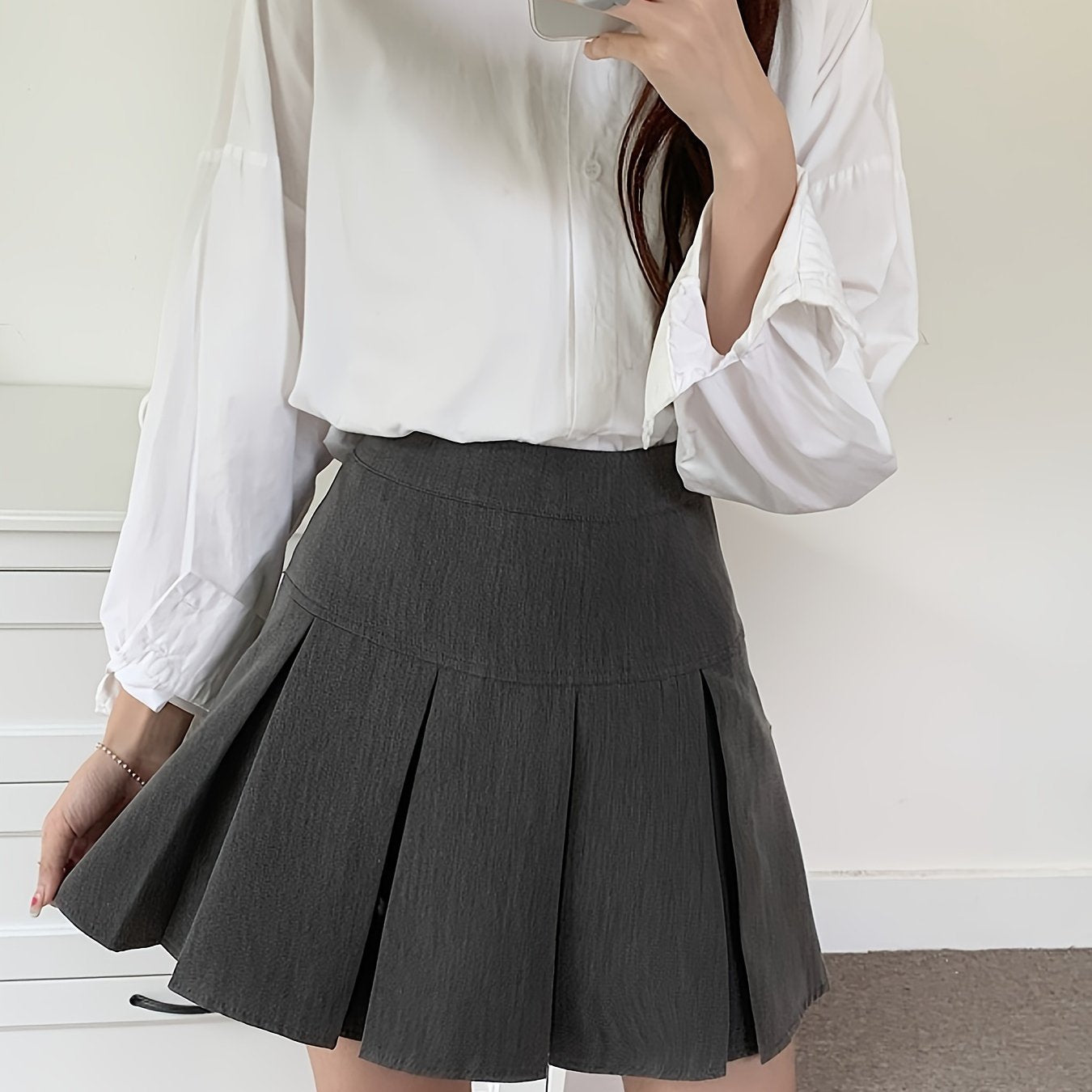 Nina | Mooie geplooide minirok met hoge taille in effen kleur