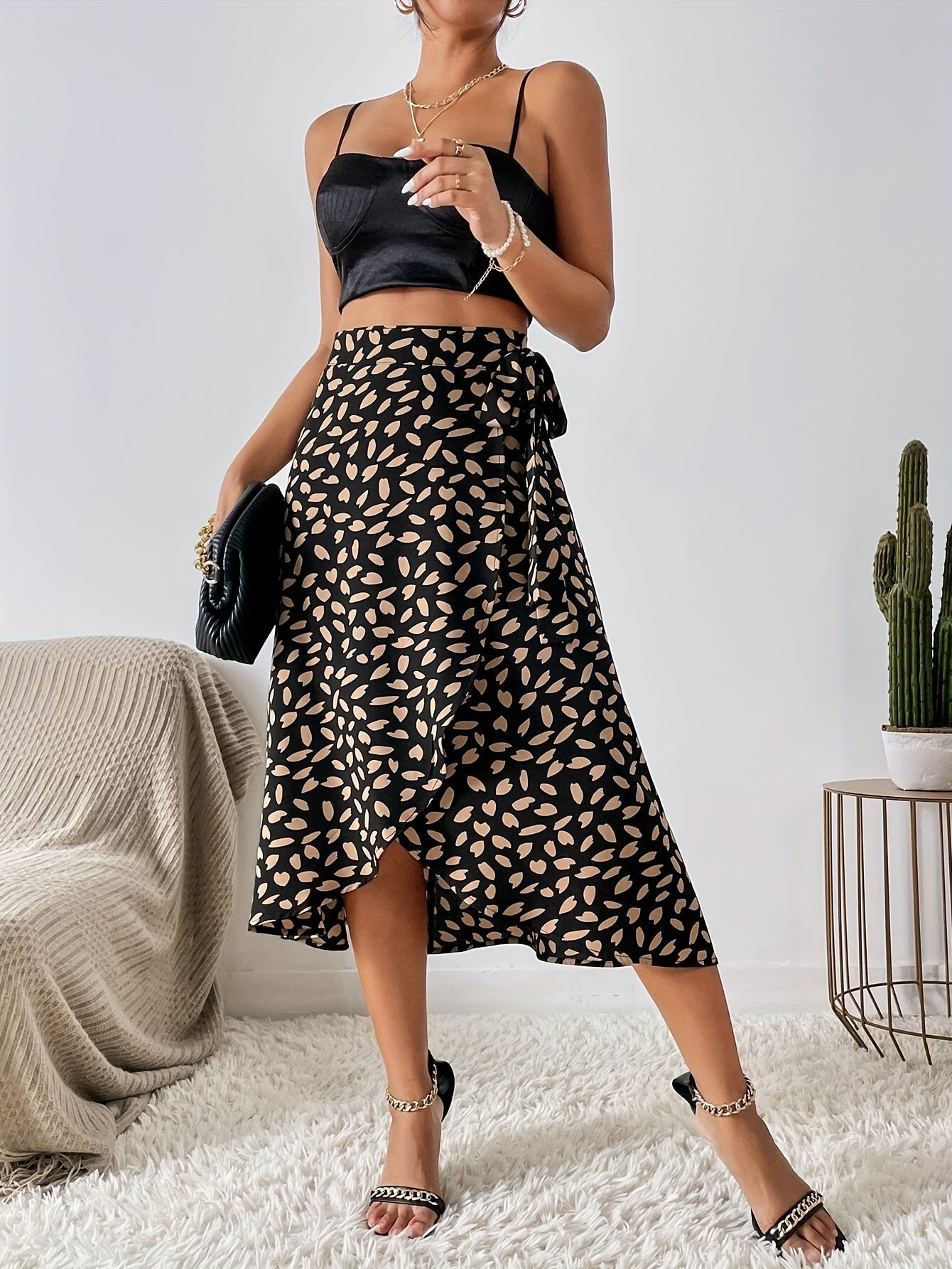 Lotte | Elegant A-line wrap skirt with a tie belt and allover print